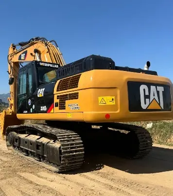 Caterpillar 330 excavator on its tracks at an earthworks site