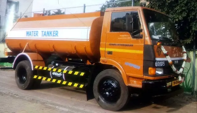 Water tanker truck with a tank marked water
